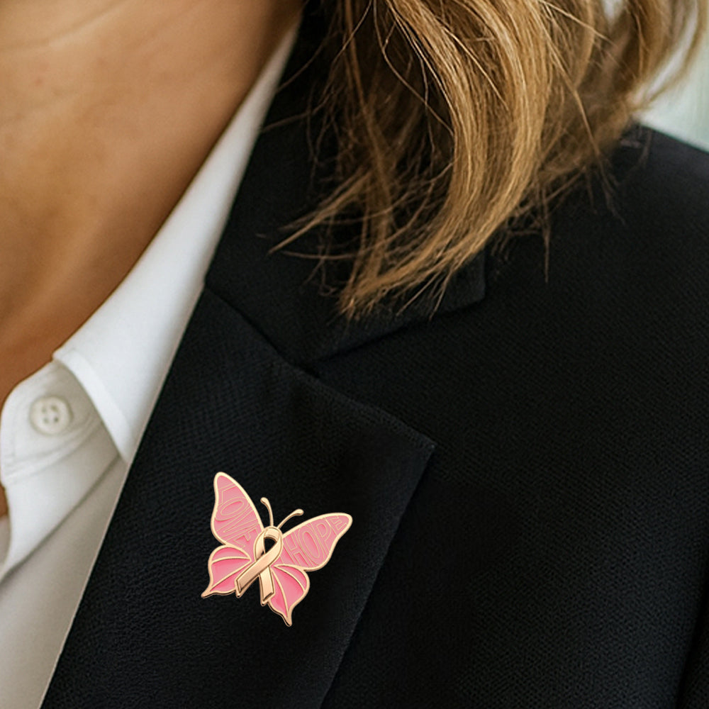 Breast Cancer Awareness Lapel Pin by Bella Forge Pink butterfly-shaped with ribbon with love and hope text on a blazer