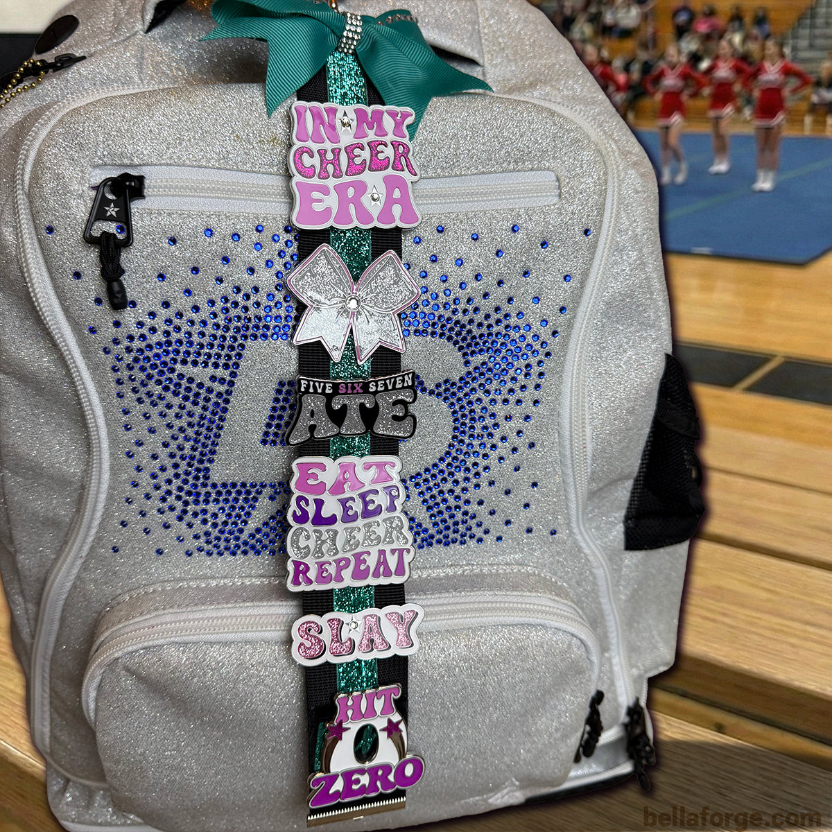 In My Cheer Era Cheer pin for backpacks by Bella Forge Pink Purple White with glitter on silver backpack