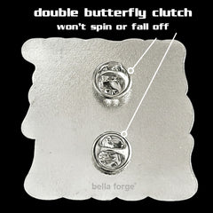 In My Cheer Era Cheer pin for backpacks by Bella Forge Pink Purple White with glitter showing back with two butterfly clutches