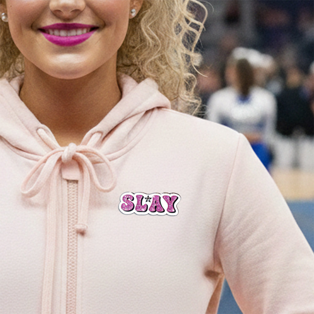 Slay Cheer pin for backpacks by Bella Forge Pink pink glitter white shown on hoodie